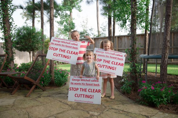 Matthew Burton's Children holding petition signs