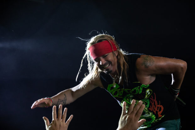 Front man Bret Michaels of Poison reaching out the fans.